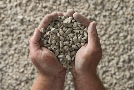 person holding 10mm aggregate