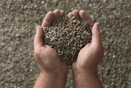 person holding 5mm aggregate