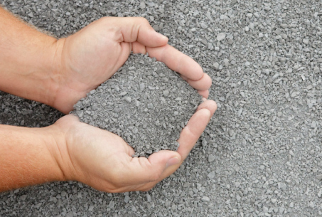 person holding crusher dust